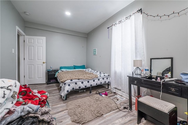 bedroom with light hardwood / wood-style flooring