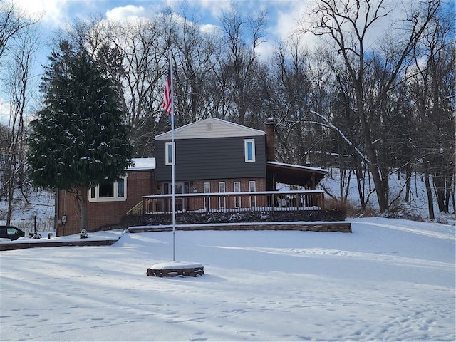 view of snow covered house