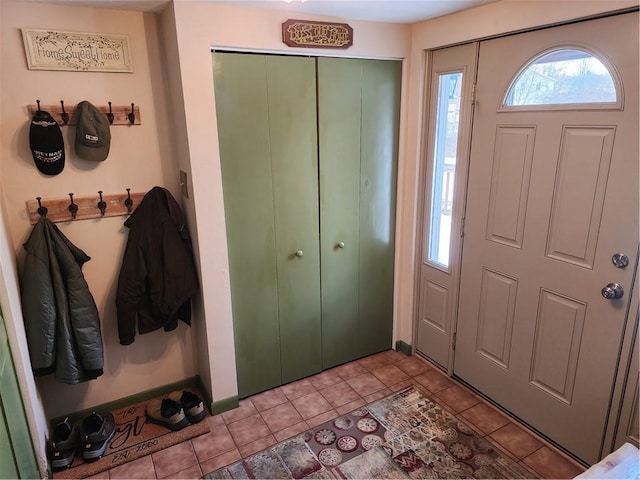 entrance foyer featuring light tile patterned flooring