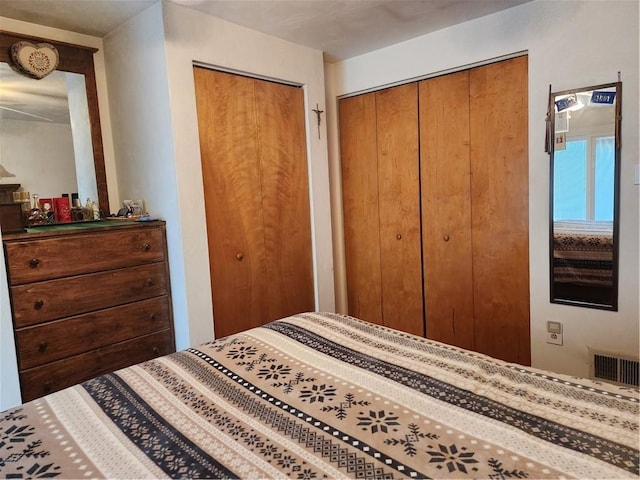 bedroom with two closets