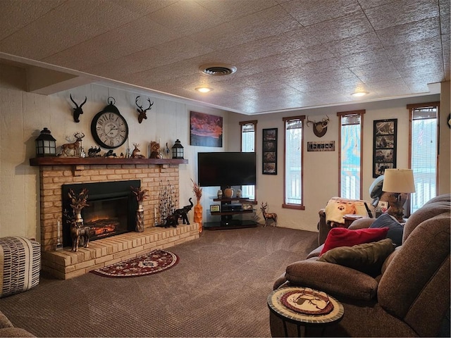 carpeted living room featuring a brick fireplace and plenty of natural light