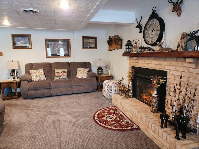 carpeted living room with a fireplace