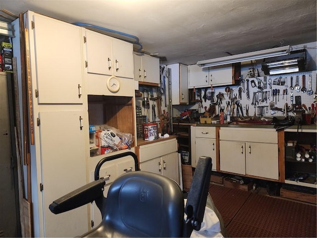 kitchen featuring white cabinets