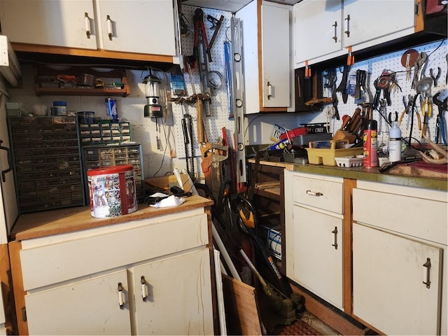 kitchen featuring white cabinets