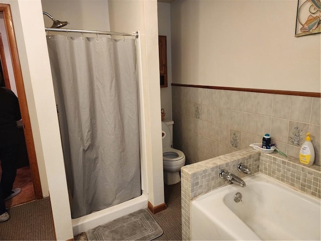 bathroom with tile walls, toilet, and plus walk in shower