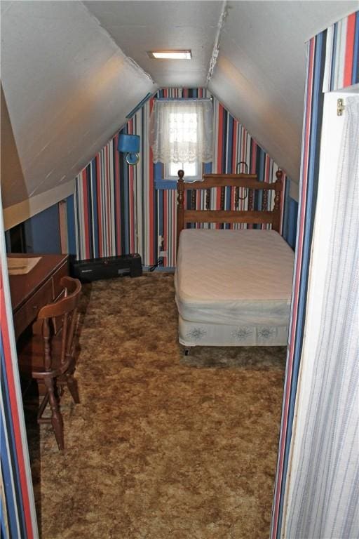 carpeted bedroom with lofted ceiling