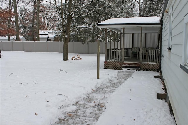 view of yard covered in snow