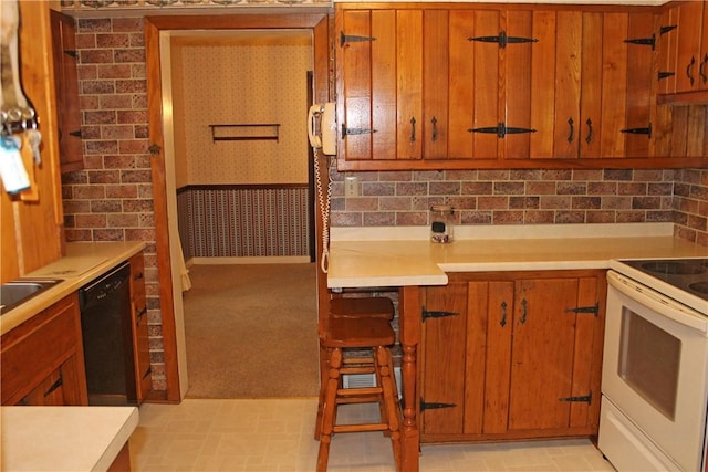 kitchen featuring white electric stove and black dishwasher