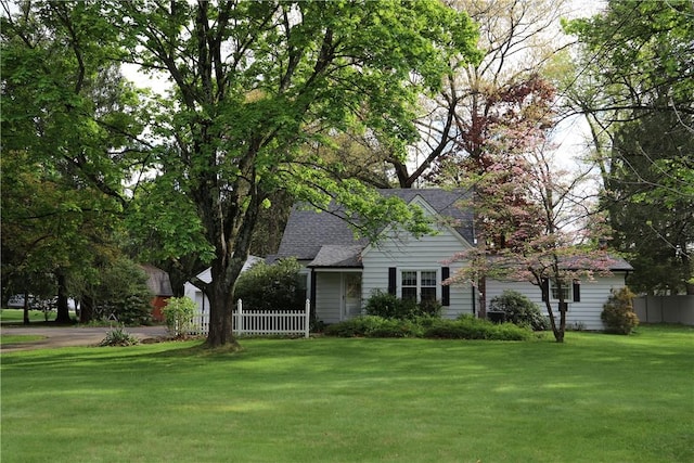 view of front of property with roof with shingles
