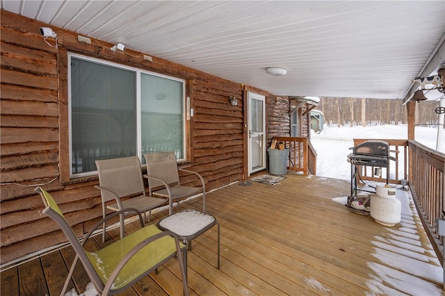 view of snow covered deck