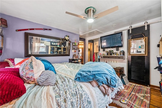 bedroom featuring ceiling fan and wood-type flooring