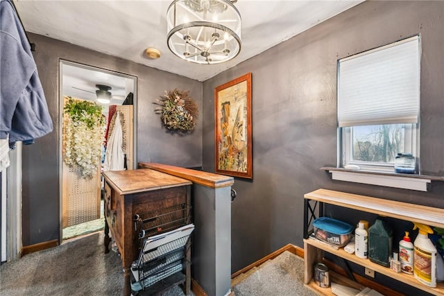 interior space featuring an inviting chandelier and carpet