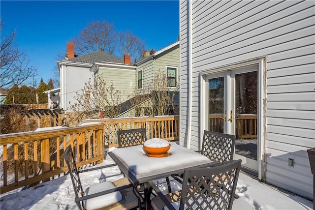 view of snow covered deck