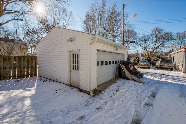 view of snow covered garage