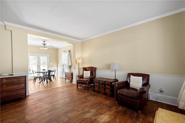 living area with ornamental molding, ceiling fan, and hardwood / wood-style flooring