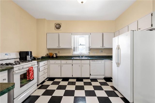 kitchen featuring sink, white appliances, and white cabinets