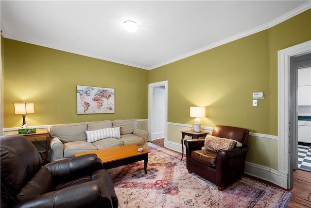 living room with hardwood / wood-style floors and crown molding