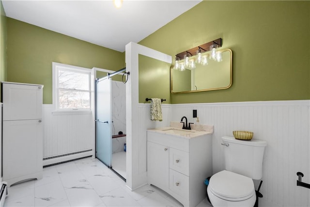 bathroom featuring toilet, a shower, a baseboard radiator, and vanity