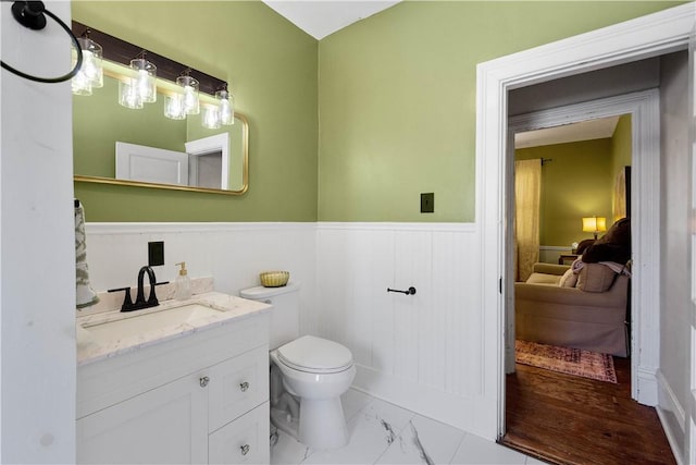 bathroom with vanity and toilet