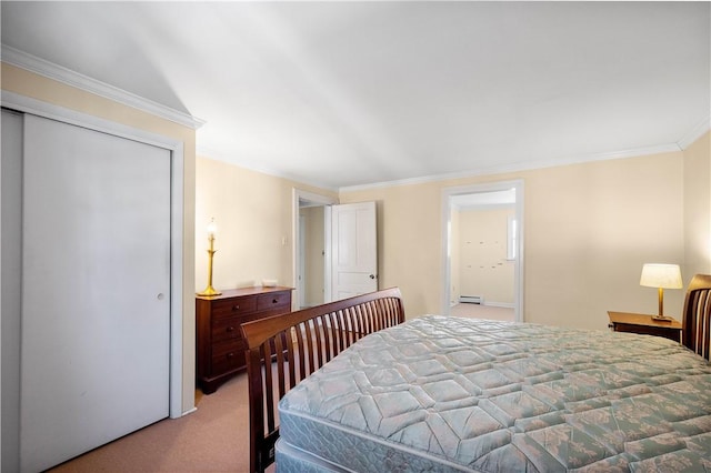 carpeted bedroom featuring baseboard heating, a closet, and crown molding