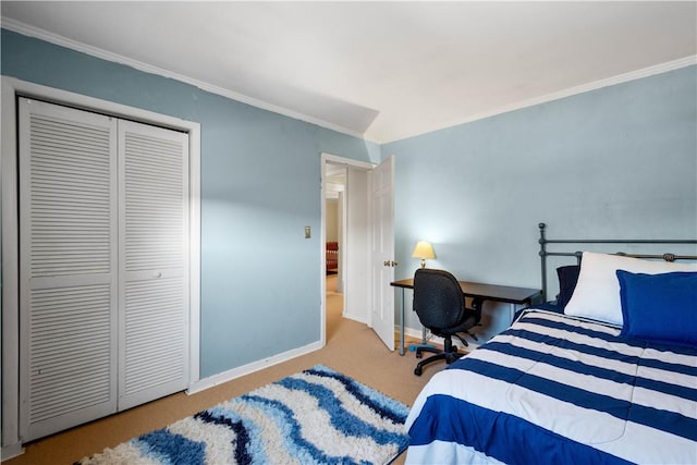 carpeted bedroom featuring a closet and crown molding