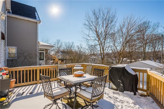 snow covered deck featuring area for grilling