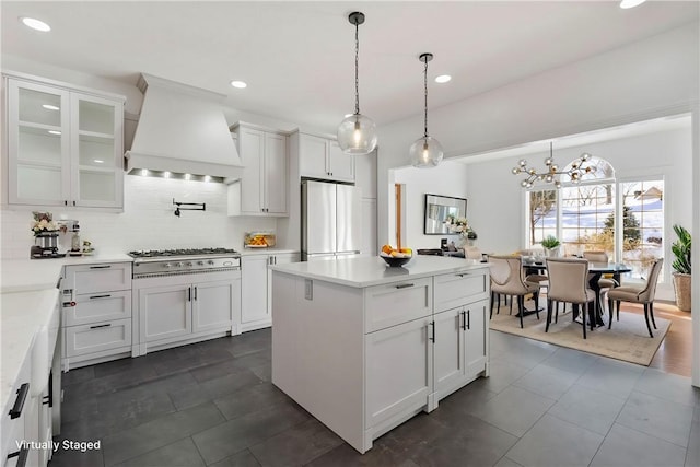 145 Cedar Rdg, Center Twp But, PA 16001 - kitchen featuring custom exhaust hood, freestanding refrigerator, decorative backsplash, gas stovetop, and white cabinets