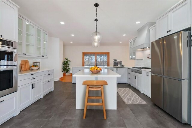 145 Cedar Rdg, Center Twp, PA 16001 - kitchen featuring appliances with stainless steel finishes, a peninsula, premium range hood, light countertops, and glass insert cabinets