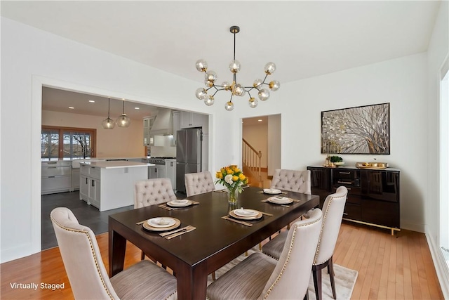 145 Cedar Rdg, Center Twp But, PA 16001 - dining space featuring stairway, a chandelier, and light wood-style flooring
