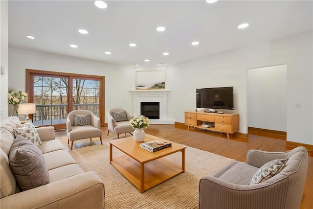 145 Cedar Rdg, Center Twp But, PA 16001 - living area featuring wood finished floors, recessed lighting, a glass covered fireplace, and baseboards