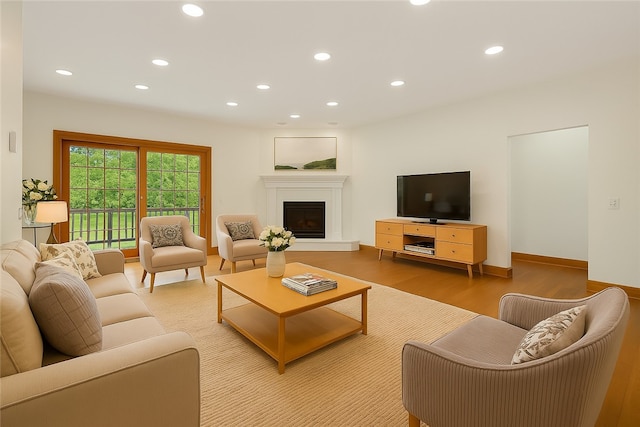 145 Cedar Rdg, Center Twp, PA 16001 - living room with recessed lighting, light wood finished floors, and a glass covered fireplace