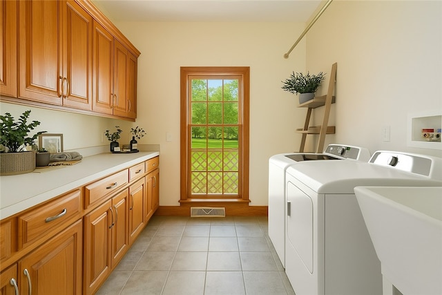 145 Cedar Rdg, Center Twp, PA 16001 - washroom featuring independent washer and dryer, cabinet space, and light tile patterned floors