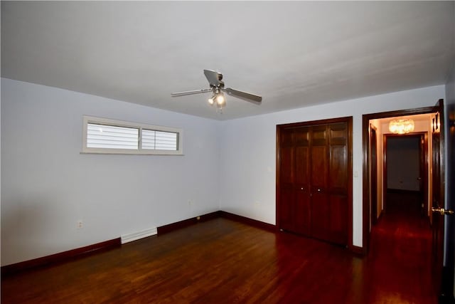 unfurnished bedroom featuring a closet, ceiling fan, and dark hardwood / wood-style floors