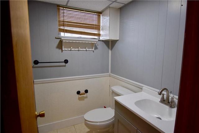 bathroom featuring toilet, tile patterned flooring, and vanity