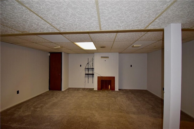 basement with a fireplace and carpet floors