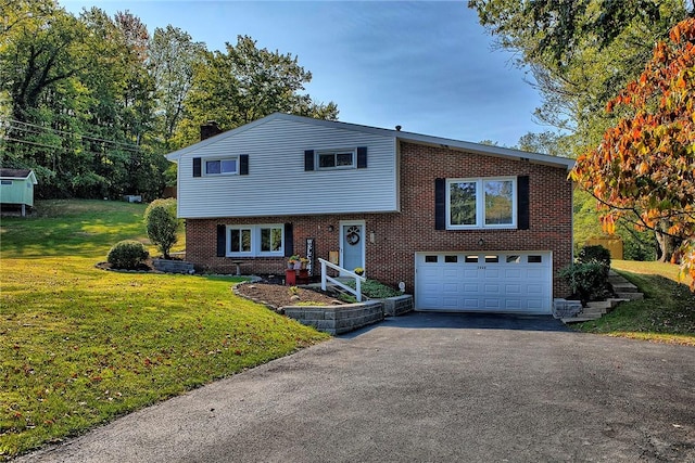 view of front of house featuring a front yard and a garage