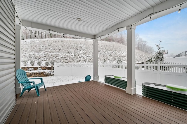 view of snow covered deck