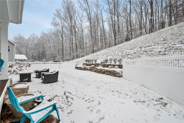 view of yard layered in snow