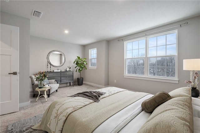 bedroom featuring light carpet