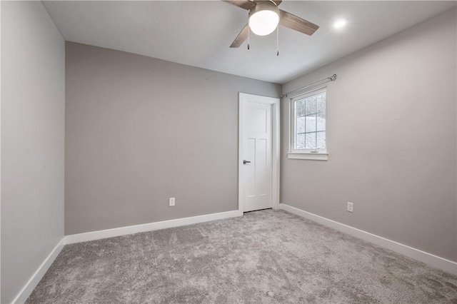 spare room featuring ceiling fan and carpet flooring