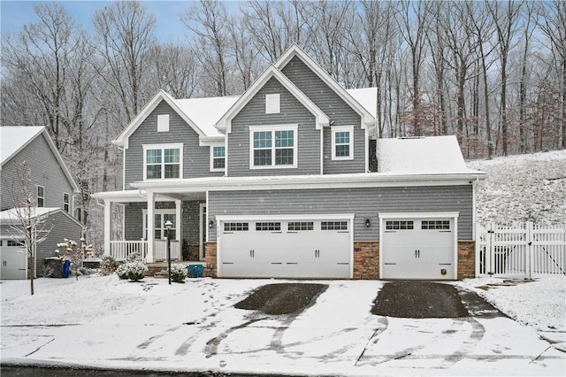 view of front of property with a porch and a garage