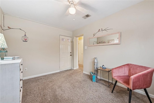 sitting room featuring ceiling fan and carpet flooring