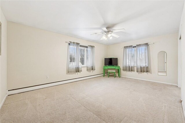 unfurnished living room featuring ceiling fan, a baseboard radiator, and carpet