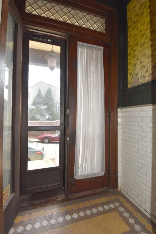 doorway featuring tile patterned floors