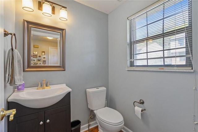 bathroom with toilet and vanity