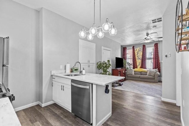 kitchen featuring stainless steel appliances, sink, white cabinets, ceiling fan, and hanging light fixtures