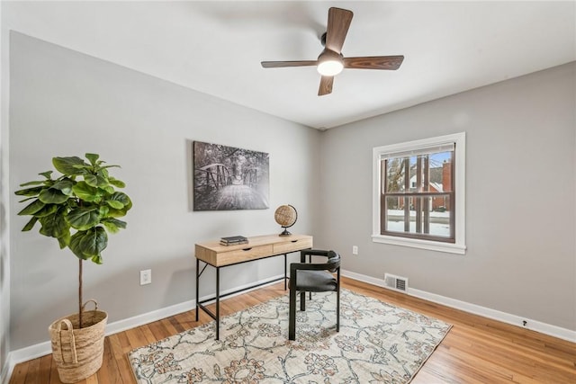 office with ceiling fan and light wood-type flooring