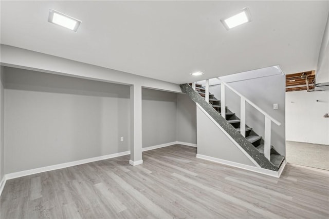 basement featuring light hardwood / wood-style floors