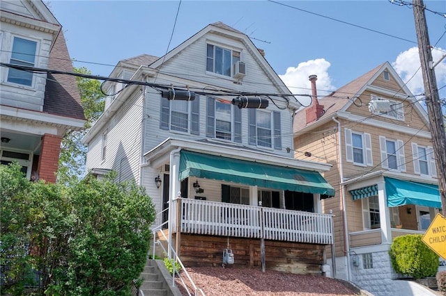 view of front of home with covered porch and cooling unit