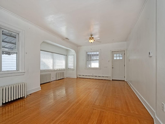 foyer entrance featuring a baseboard heating unit, radiator heating unit, and ceiling fan